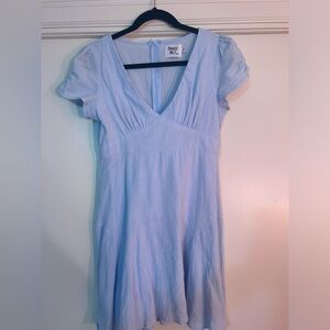 Light blue, V-neck dress.